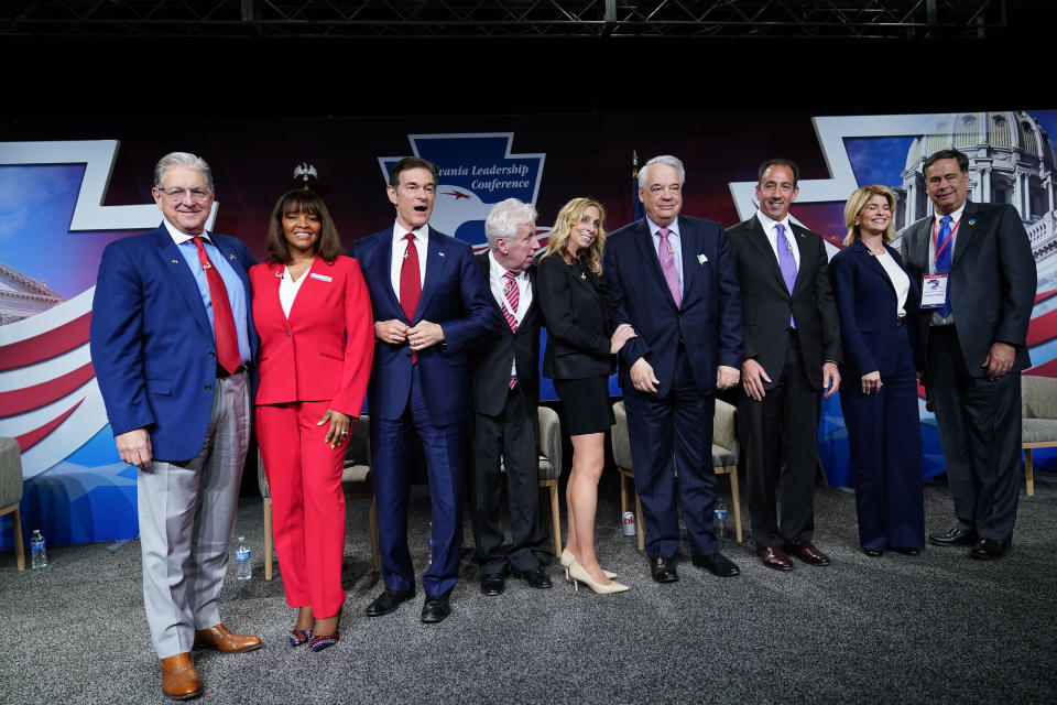 FILE—In this file photo from April 2, 2022, George Bochetto, Kathy Barnette, Mehmet Oz, Jeffrey Lord, Rose Tennent, John Gizzie, Jeff Bartos, Carla Sands, and Lowman Henry pose for a photograph during a forum for Republican candidates for U.S. Senate in Pennsylvania at the Pennsylvania Leadership Conference in Camp Hill, Pa. Republicans have made anger over the 2020 election a staple of this year's mid-term primary campaigns as Democrats appear prepared to tie them to the Jan. 6 insurrection at the U.S. Capitol, contending that Republican-sponsored election legislation is an attack on voting rights. Pennsylvania's primary election is May 17. (AP Photo/Matt Rourke, File)