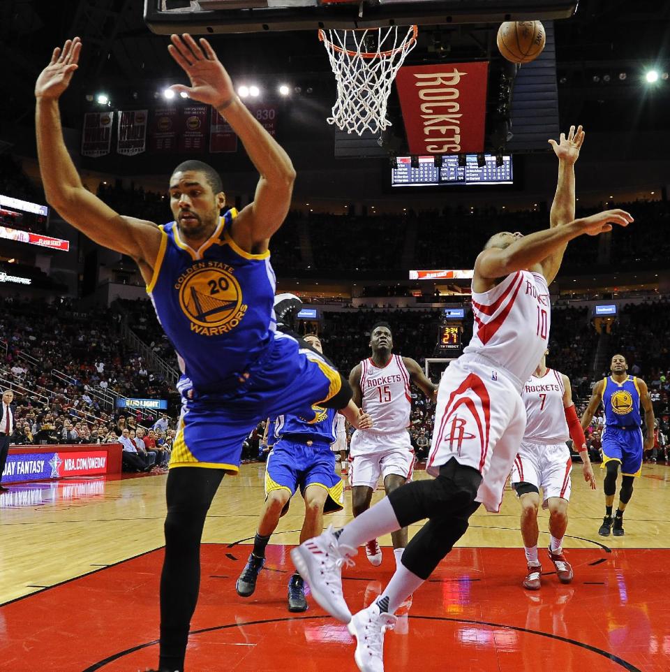 Houston Rockets guard Eric Gordon, right, shoots next to Golden State Warriors forward James Michael McAdoo (20) during the first half of an NBA basketball game, Friday, Jan. 20, 2017, in Houston. (AP Photo/Eric Christian Smith)