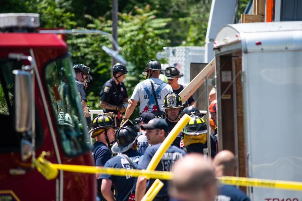 First responders assemble outside of a building that was struck by a vehicle on Salt Point Turnpike in Poughkeepsie on Monday, June 20, 2022.