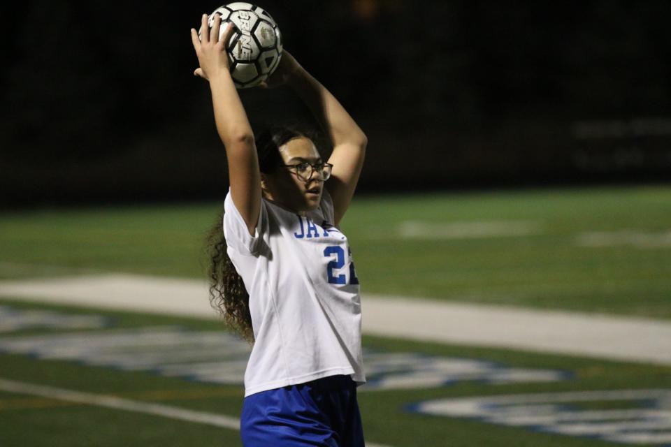 Perry's Florella Oliver (22) sends the ball back in during the first half against Des Moines Christian on Monday, March 25, 2024, in Des Moines.