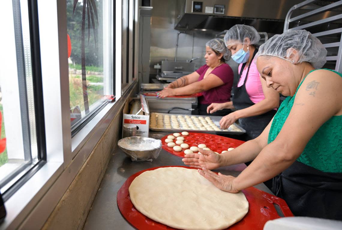 Zuly Martinez, Diana Forero and Maria Guzman prepare Sonoran-style flour tortillas at Yoli Tortilleria, a finalist in the Outstanding Bakery category for the 2023 James Beard Awards.