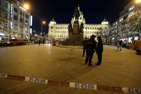 Police officers are seen at the scene where a man set himself on fire in downtown Prague, Czech Republic January 18, 2019. REUTERS/Milan Kamm