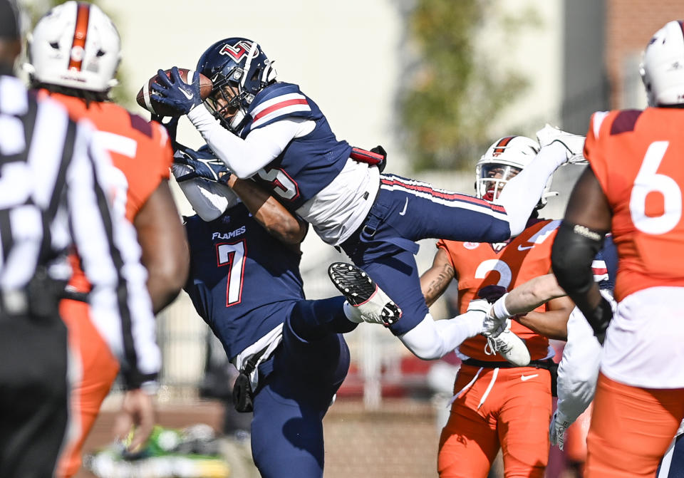 Liberty wide receiver Noah Frith catches the ball against Virginia Tech during an NCAA college football game in Lynchburg, Va., Saturday, Nov. 19, 2022. (Paige Dingler/The News & Advance via AP)