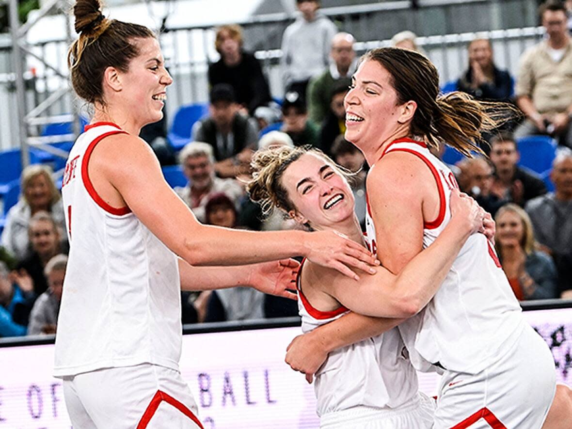 From left, Michelle Plouffe, Paige Crozon and Katherine Plouffe collected Canada's first-ever silver medal at the FIBA 3x3 Basketball World Cup in Sunday's 16-13 loss to France in Antwerp, Belgium. (Tom Goyvaerts/Belga Mag/AFP via Getty Images - image credit)