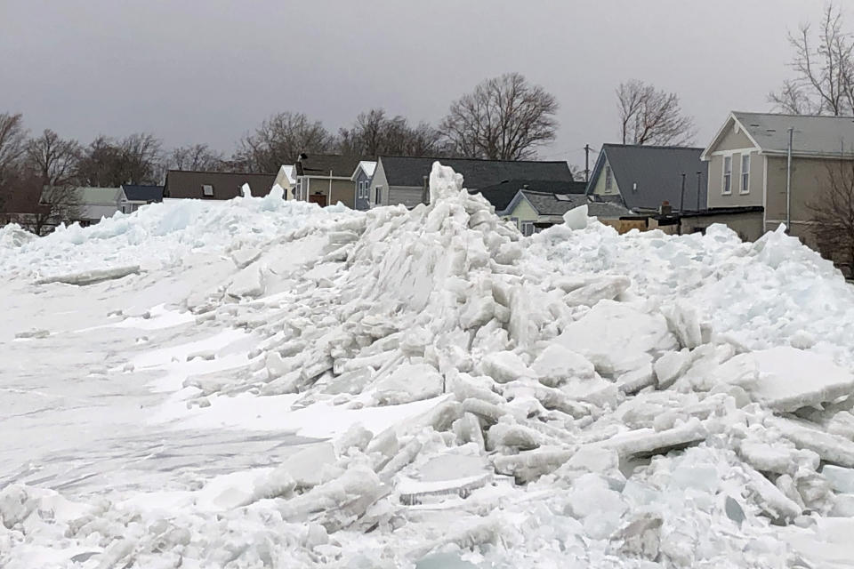 Mounds of ice collect along the Lake Erie shore at Hoover Beach, in Hamburg, N.Y., Monday, Feb. 25, 2019. High winds howled through much of the nation's eastern half for a second day Monday, cutting power to hundreds of thousands of homes and businesses, closing schools, and pushing dramatic mountains of ice onto the shores of Lake Erie.(AP Photo/Carolyn Thompson)