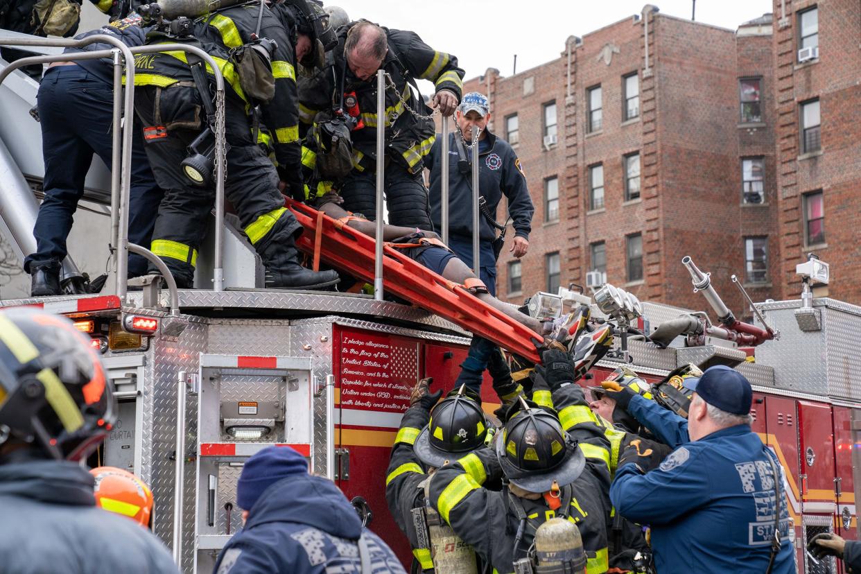 Thirty people, including several children, were critically injured, with firefighters making dramatic rescues using tower ladders and ladders, after a fire broke out inside a third-floor duplex apartment at 333 East 181st St. in the Bronx on Sunday, Jan. 9, 2022.