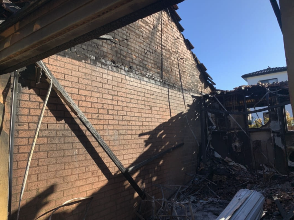 The roof missing from the home's garage.