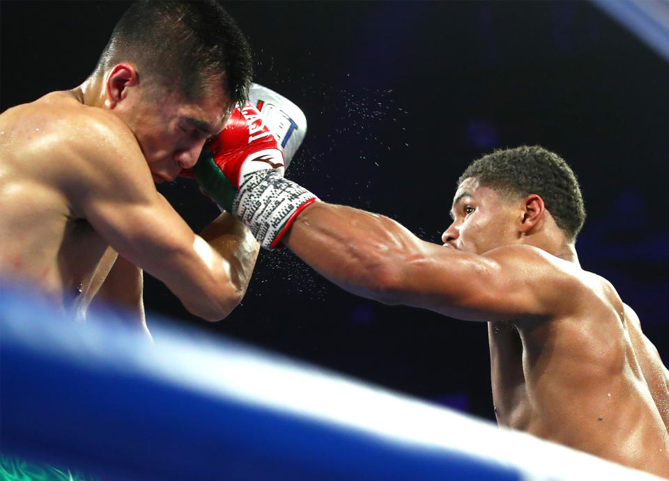 Shakur Stevenson (R) lands a punch vs. Joet Stevenson during their WBO featherweight world title fight at the Atlantis Casino Resort Spa in Reno, Nevada. (Mikey Williams/Top Rank)