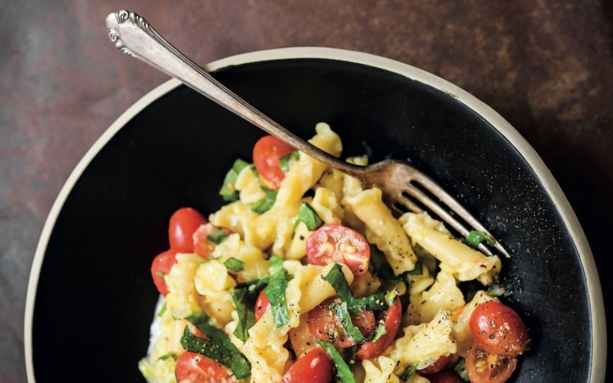 <p>Connie Miller</p><p>This cheery weeknight-friendly pasta recipe, from Milk Street: The New Rules, is proof that you don’t always need cream or cheese for creamy results.</p><p><strong>Get the recipe: <a href="/949573/parade/campanelle-pasta-with-sweet-corn-tomatoes-and-basil/" data-ylk="slk:Campanelle Pasta with Sweet Corn, Tomatoes and Basil;elm:context_link;itc:0;sec:content-canvas" class="link rapid-noclick-resp"><em>Campanelle Pasta with Sweet Corn, Tomatoes and Basil</em></a></strong></p>