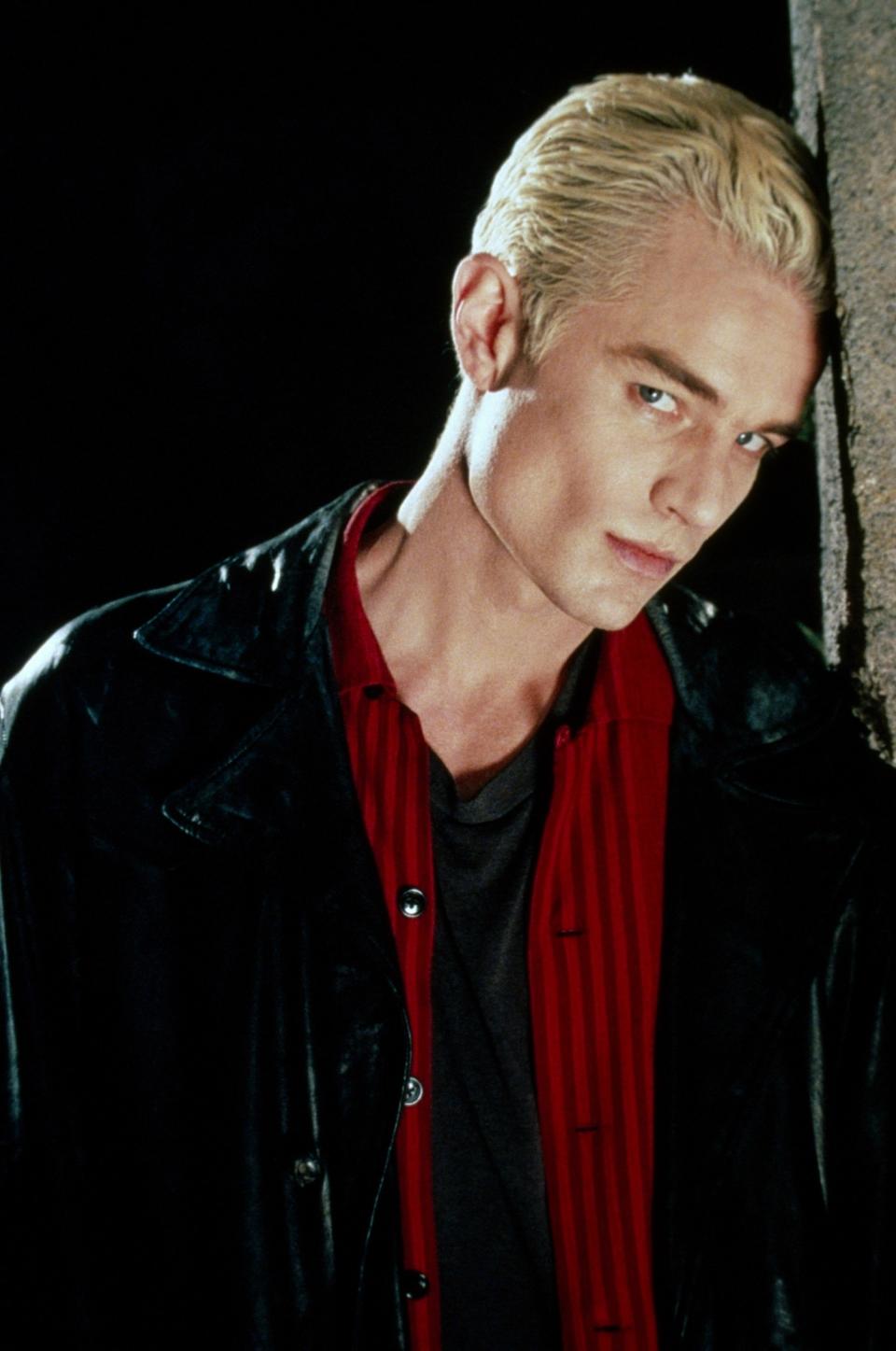 Spike from Buffy the Vampire Slayer in a black leather jacket with a red shirt