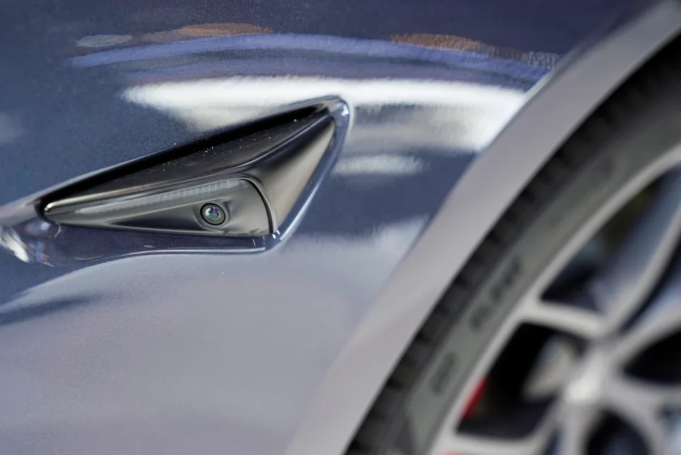 A camera is seen on the body of a Tesla electric vehicle (EV) during a media day for the Auto Shanghai show in Shanghai, China April 20, 2021. REUTERS/Aly Song