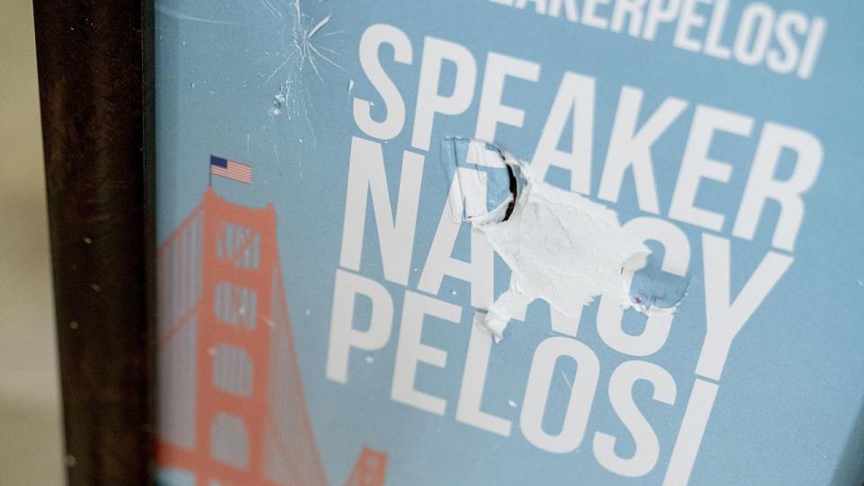 The sign in front of the office of Speaker of the House Nancy Pelosi, D-Calif., is damaged as seen in the early morning hours at the Capitol in Washington, Thursday, Jan. 7, 2021, after protesters stormed the Capitol.