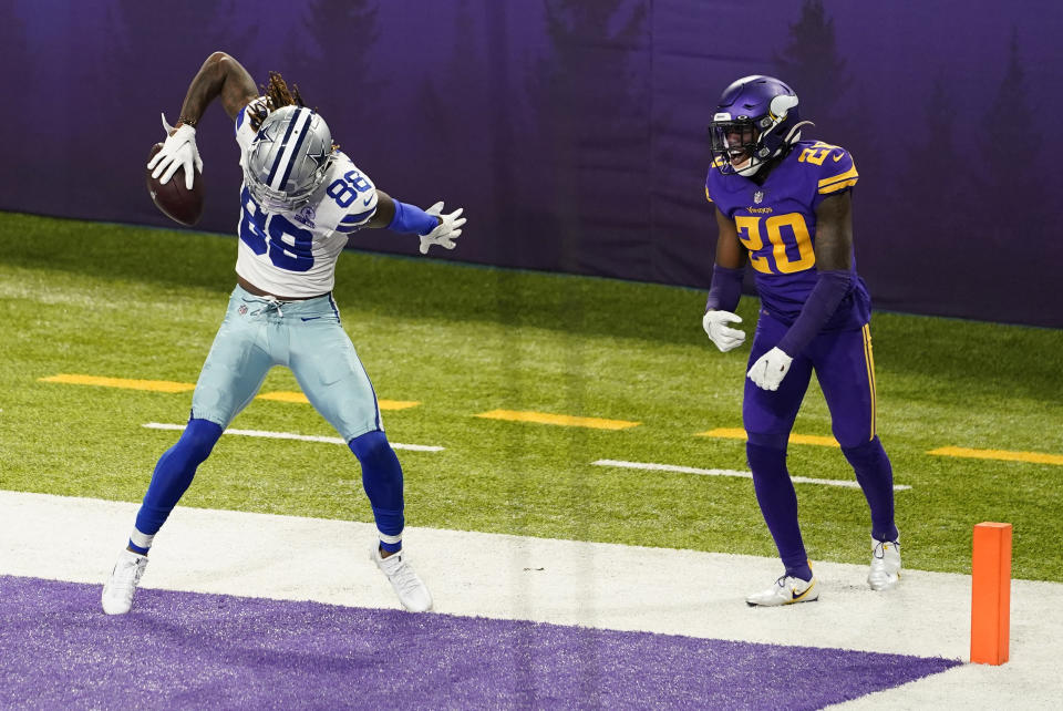 Dallas Cowboys wide receiver CeeDee Lamb (88) celebrates in front of Minnesota Vikings cornerback Jeff Gladney after scoring a touchdown. (AP Photo/Jim Mone)