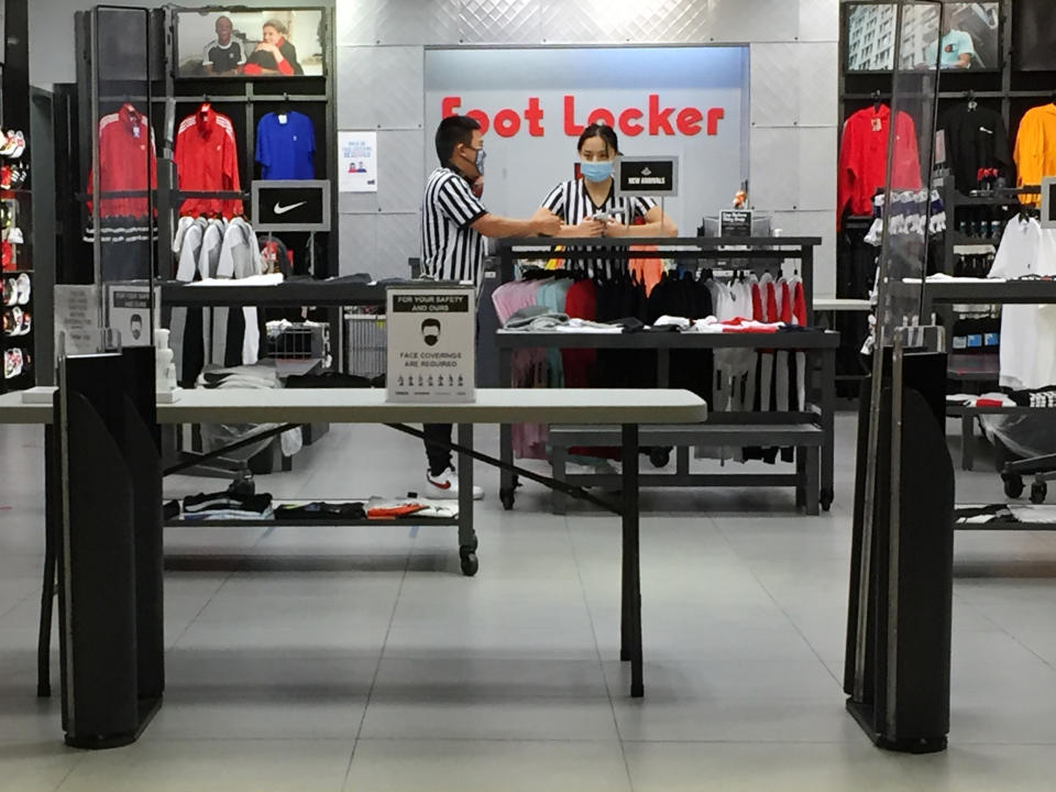 Staff wearing face masks at a Foot Locker store during the novel coronavirus (COVID-19) pandemic in Toronto, Ontario, Canada on October 09, 2020. (Photo by Creative Touch Imaging Ltd./NurPhoto via Getty Images)