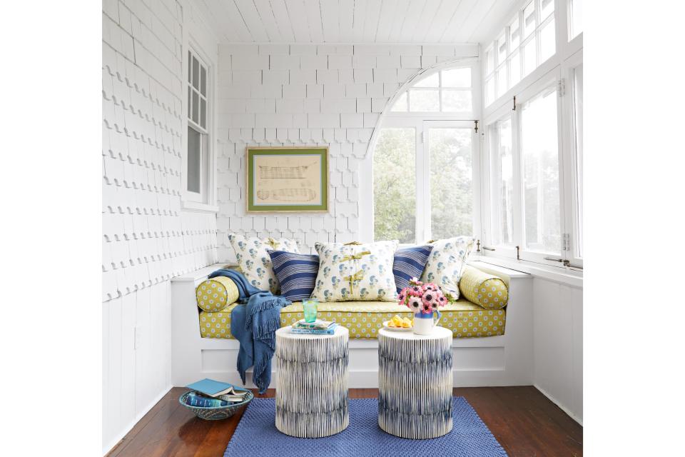 <p>A sleeping porch, open to Maine summer breezes, has a cozy daybed that becomes the ideal spot for reading with children or taking an afternoon nap.</p>