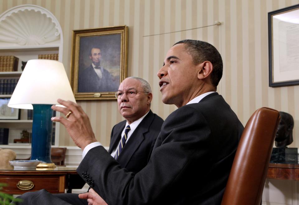 President Barack Obama talks with reporters after his meeting with former Secretary of State Colin Powell, left, on the importance of ratifying the New START Treaty, Wednesday, Dec. 1, 2010, in the Oval Office at the White in Washington.