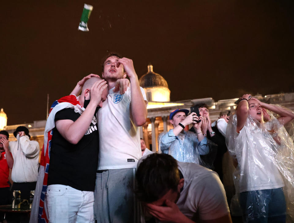 Soccer Football - Euro 2020 - Final - Fans gather for Italy v England - London, Britain - July 11, 2021 England fans react after Italy wins the Euro 2020 at Trafalgar Square REUTERS/Henry Nicholls