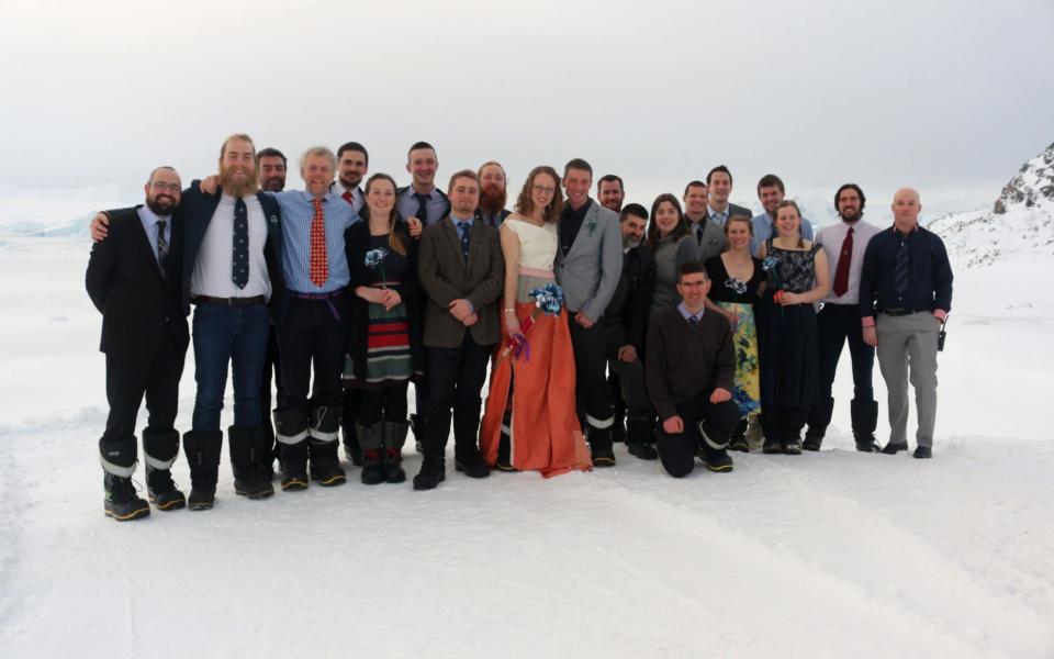 Polar field guides Julie Baum and Tom Sylvester with their fellow researchers on the day of the wedding - Credit:  British Antarctic Survey/PA