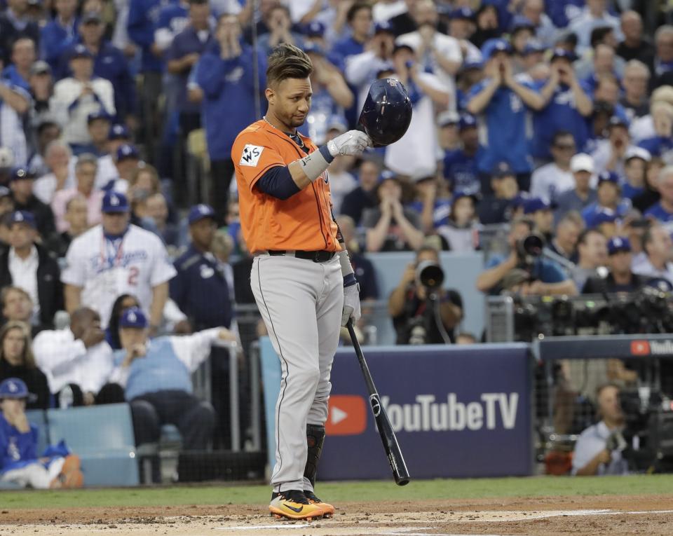 Houston Astros’ Yuli Gurriel tips his hat as he gestures to Los Angeles Dodgers starting pitcher Yu Darvish during the first inning of Game 7 of baseball’s World Series Wednesday, Nov. 1, 2017, in Los Angeles. (AP Photo/David J. Phillip)