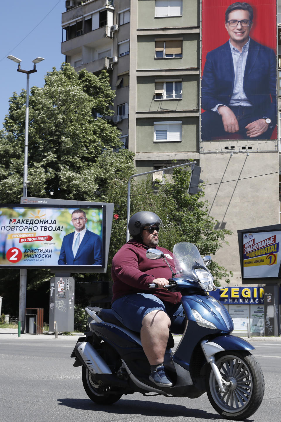 Posters of Hristijan Mickoski, the leader of the center-right main opposition VMRO-DPMNE party, left and Stevo Pendarovski, incumbent President and the presidential candidate backed by the ruling social democrats (SDSM), top right are displayed in a street in Skopje, North Macedonia, on Monday, May 6, 2024. Voters go to the polls on Wednesday in North Macedonia to cast ballots for parliamentary election and presidential runoff, for the second time in two weeks. (AP Photo/Boris Grdanoski)