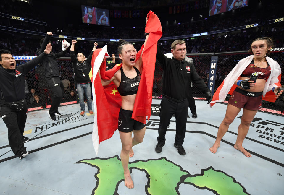 LAS VEGAS, NEVADA - MARCH 07: Zhang Weili of China celebrates after her split-decision victory over Joanna Jedrzejczyk of Poland in their UFC strawweight championship fight during the UFC 248 event at T-Mobile Arena on March 07, 2020 in Las Vegas, Nevada. (Photo by Jeff Bottari/Zuffa LLC)