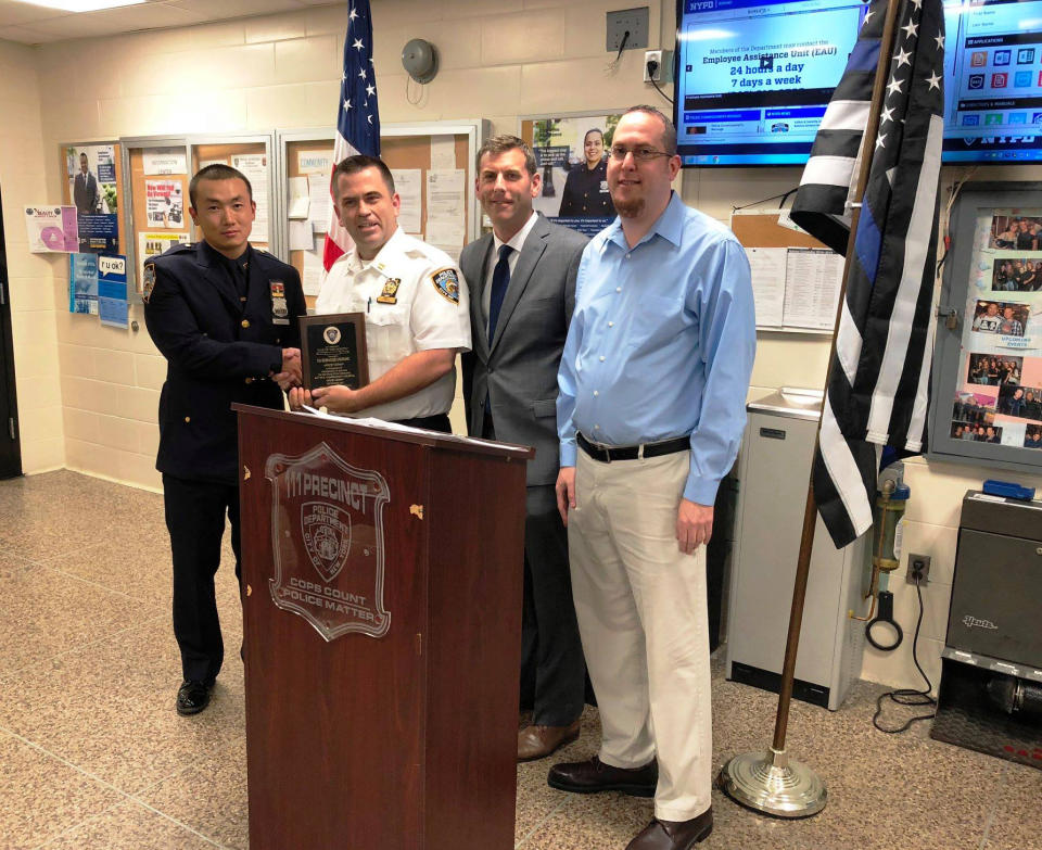 New York Police Department officer Baimadijie Angwang, left, in 2018. (Assemblyman Edward Braunstein)