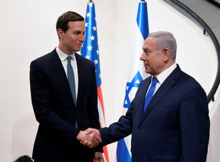 Israeli Prime Minister Benjamin Netanyahu shakes hands with Senior White House advisor Jared Kushner during their meeting in Jerusalem