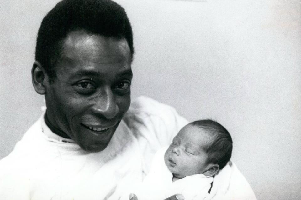 Pele with his new born daughter Jennifer Cholby Nasimento born in New York.