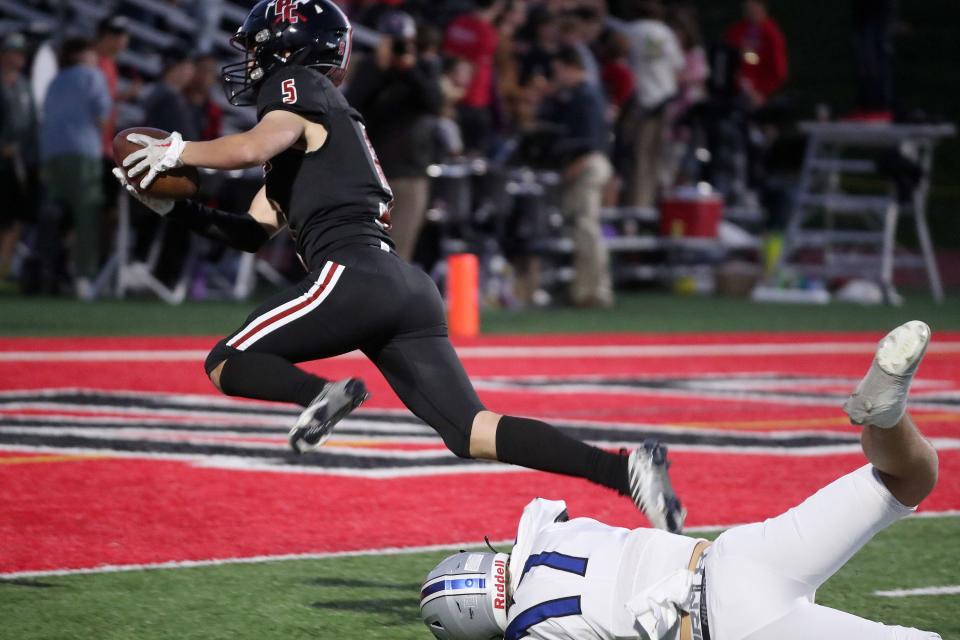 Park City’s Tyler Montzingo dives past Stansbury’s Xaviah Patch to score a touchdown during a football game at Park City High School in Park City on Friday, Sept. 15, 2023. Park City won 21-17. | Kristin Murphy, Deseret News
