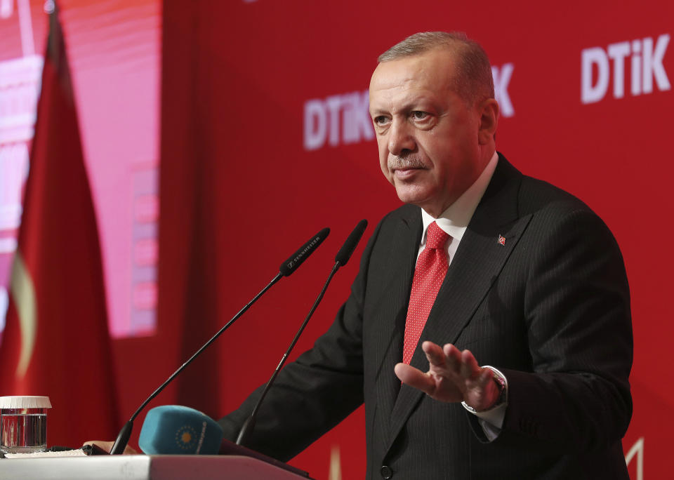 Turkey's President Recep Tayyip Erdogan addresses the World Turkish Business Council meeting, in Baku, Azerbaijan, Monday. Oct. 14, 2019. Erdogan says Turkey's military offensive into northeast Syria is as "vital" to Turkey as its 1974 military intervention in Cyprus, which split the island in two. (Presidential Press Service via AP, Pool)