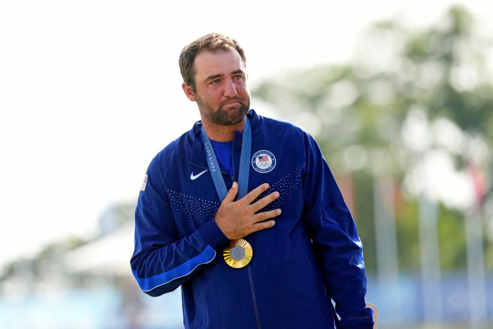 Aug 4, 2024; Saint-Quentin-en-Yvelines, France; Scottie Scheffler of Team United States reacts after winning the gold medal in men’s individual stroke play during the Paris 2024 Olympic Summer Games at Le Golf National.