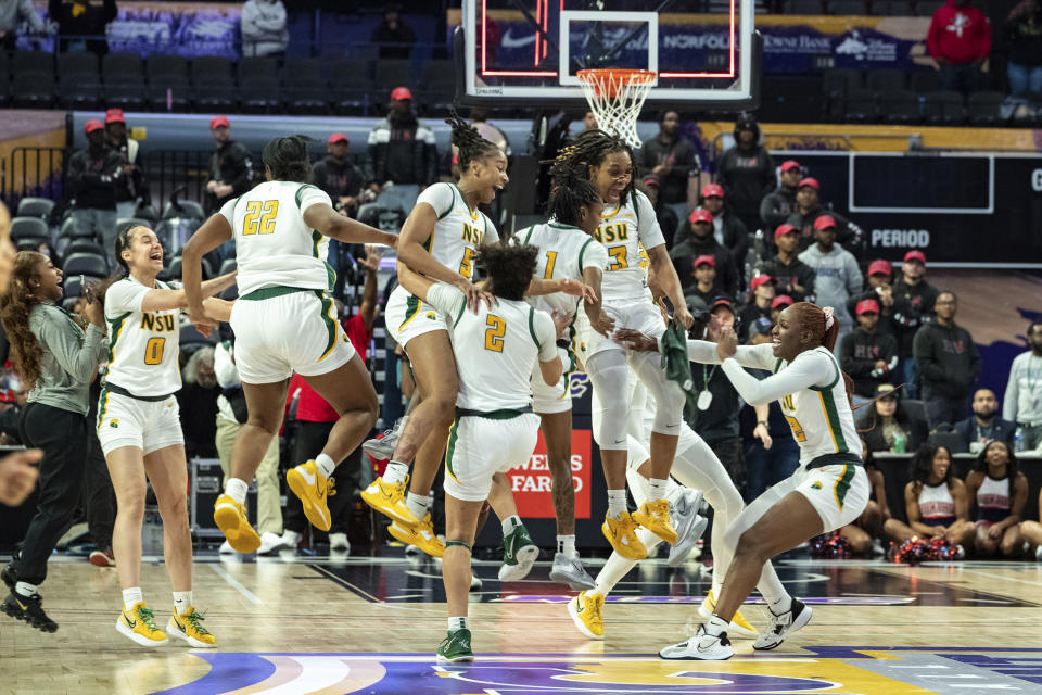 Norfolk State celebrates after defeating Howard in an NCAA college basketball game in the championship of the Mid-Eastern Athletic Conference Tournament, Saturday, March 11, 2023, in Norfolk, Va. (AP Photo/Mike Caudill)