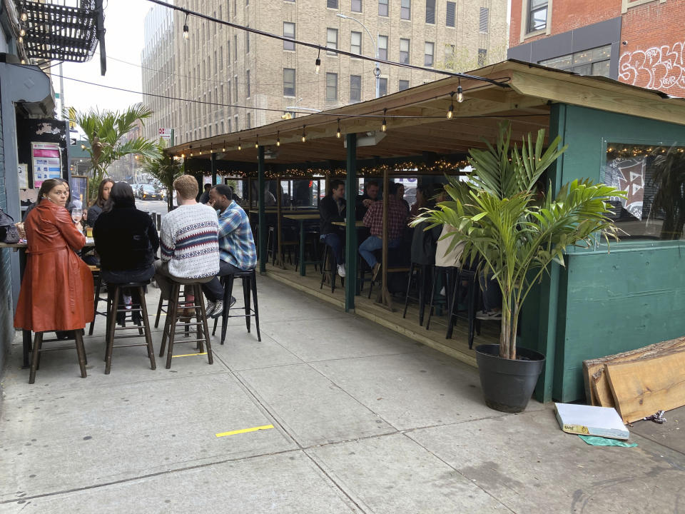 Photo by: zz/STRF/STAR MAX/IPx 2020 12/12/20 Outdoor dining with social distancing measures in Downtown Manhattan on December 12, 2020. Though certain restrictions were eased as part of the Phase 4 Reopening in New York City during the worldwide coronavirus pandemic, recent surges in cases of the virus have led restaurant owners and managers to create and design unique protective barriers to help keep their patrons safe and sheltered from inclement weather. Here, outdoor diners brave the cold temperatures of December in New York City. (NYC)