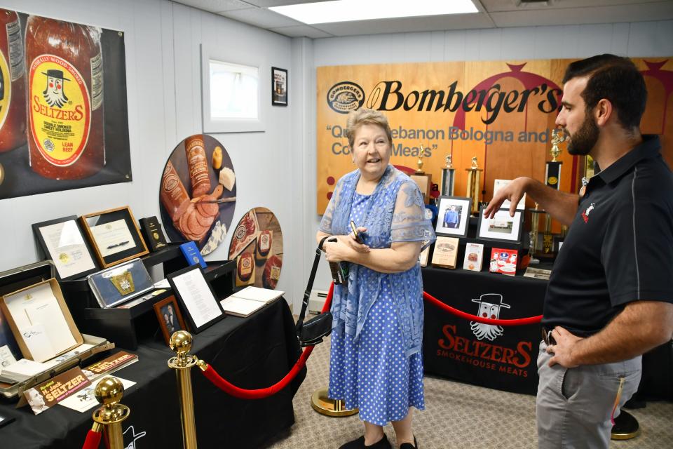 Lebanon County Commissioner Jo Ellen Litz gets a tour from Seltzer CEO and owner Austin Wagoner of the new museum section of the Smokehouse Experience Program, highlighting some of the company's long history.