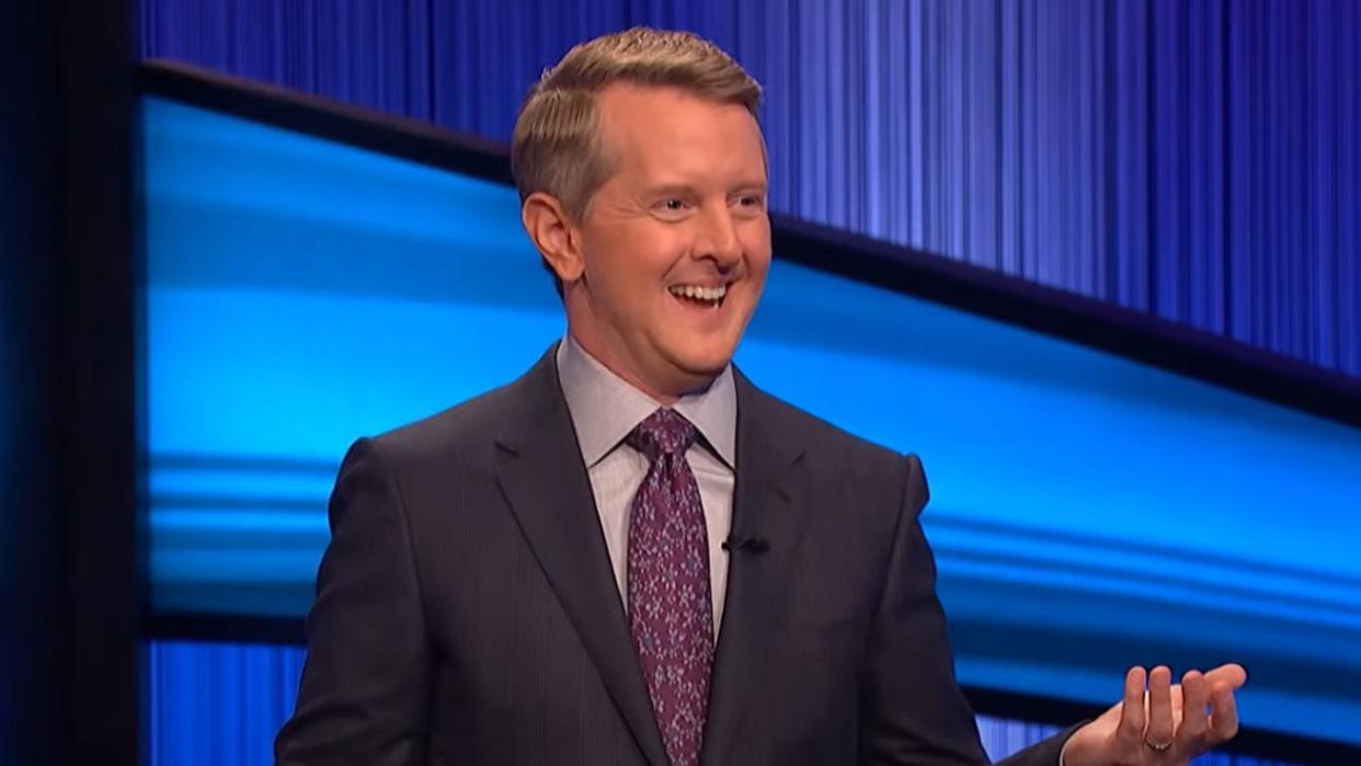  Ken Jennings smiling and hosting Jeopardy 