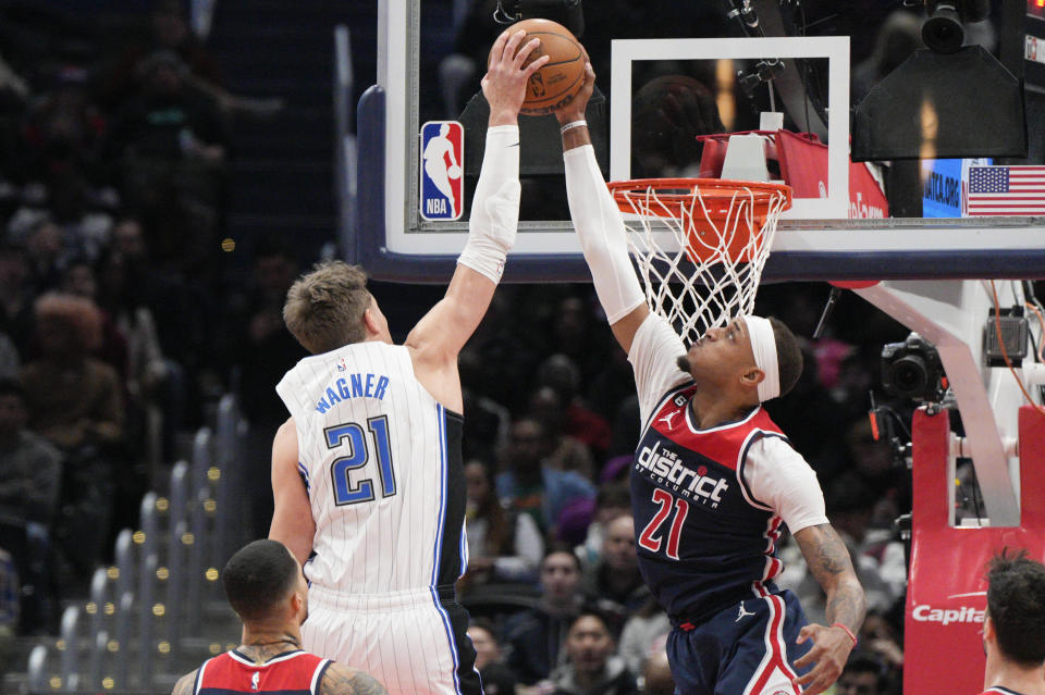 Orlando Magic center Moritz Wagner, left, shoots as Washington Wizards center Daniel Gafford, right, blocks the shot during the first half of an NBA basketball game, Saturday, Jan. 21, 2023, in Washington. (AP Photo/Jess Rapfogel)