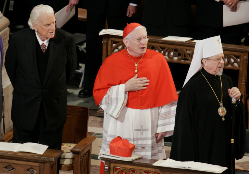 Graham (left) is joined by His Eminence William Cardinal Keeler, Archbishop of Baltimore (center) and Orthodox Church of America Archbishop of Washington, Metropolitan Herman, during the 55th Presidential Inaugural Prayer Service at the National Cathedral in Washington on Jan.&nbsp;21, 2005.