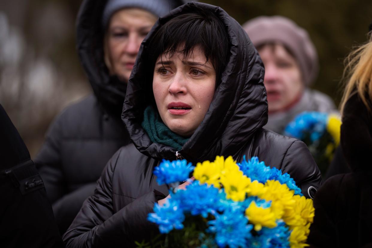 A woman cries during a memorial service to mark the one-year anniversary of the start of the Russia Ukraine war (Copyright 2023 The Associated Press. All rights reserved)
