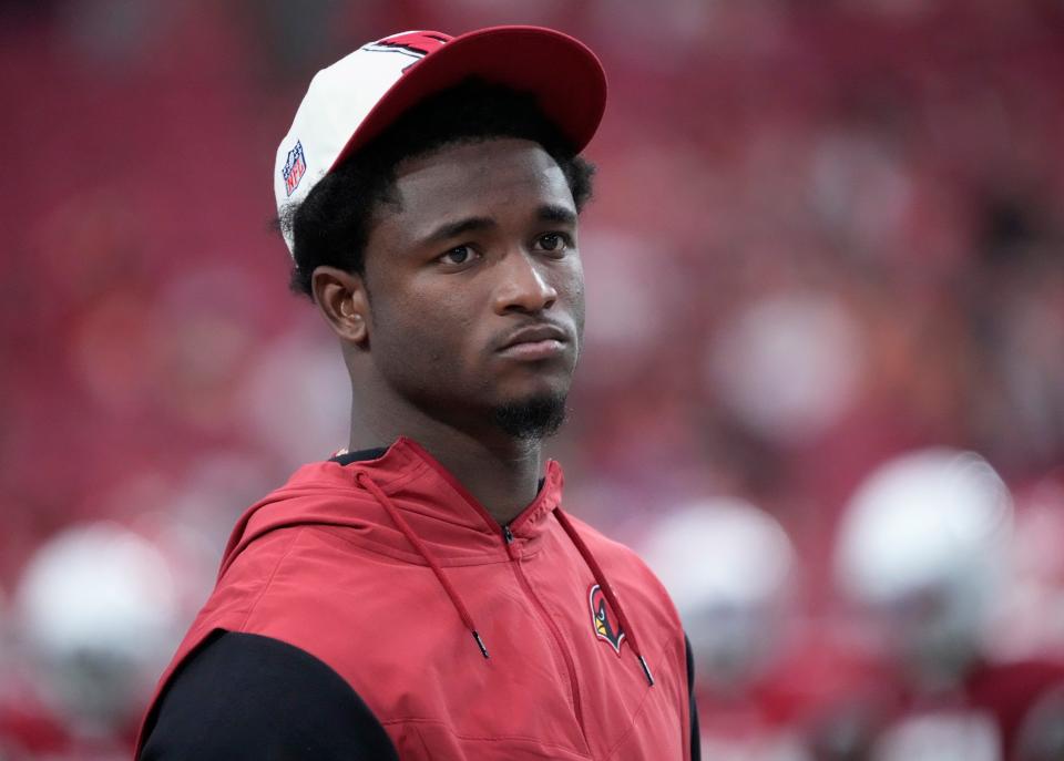 Sep 11, 2022; Glendale, Arizona, United States;  Arizona Cardinal cornerback Trayvon Mullen Jr. watches his team play against the Kansas City Chiefs during the fourth quarter at State Farm Stadium. Mullen was acquired in a trade from the Raiders.