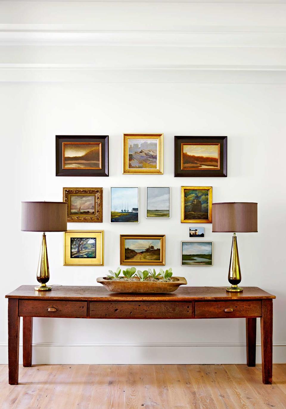 Wooden table multiple picture frames lamps