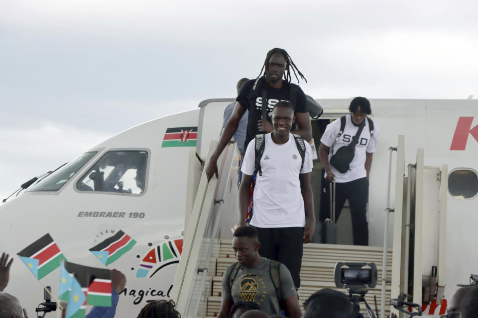 The South Sudanese basketball team arrive at Juba International airport, South Sudan, Tuesday, Sept. 5, 2023. Basketball has united the South Sudanese. The country which gained its independence just 12 years ago is still celebrating the men’s national team after its first-ever qualification for the Olympics. South Sudan will play at the Paris Olympics as the automatic qualifier from Africa thanks to a 101-78 win over Angola a week ago at the basketball World Cup in the Philippines. (AP Photo Samir Bol)