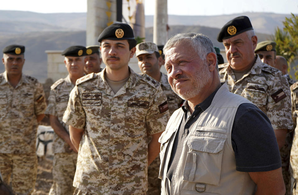 Jordan’s King Abdullah II, second right, tours the Baqura enclave formerly leased by Israel with Crown Prince Hussein and military officers, Monday, Nov. 11, 2019. Jordan’s decision not to renew the leases on the Baqura and Ghamr enclaves, known in Hebrew as Naharayim and Tzofar, were a fresh blow to Israel and Jordan’s rocky relations 25 years after the two countries signed a peace deal. (Yousef Allan/Jordanian Royal Court via AP)