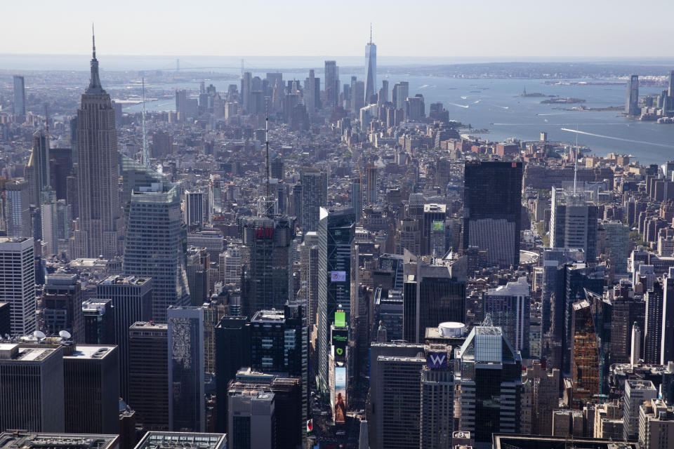 The view from an upper floor of the Central Park Tower shows Times Square, lower center, the Empire State Building, left, and One World Trade Center, center background, Tuesday, Sept. 17, 2019 in New York. At 1550 feet (472 meters) the tower is the world's tallest residential apartment building, according to the developer, Extell Development Co. (AP Photo/Mark Lennihan)