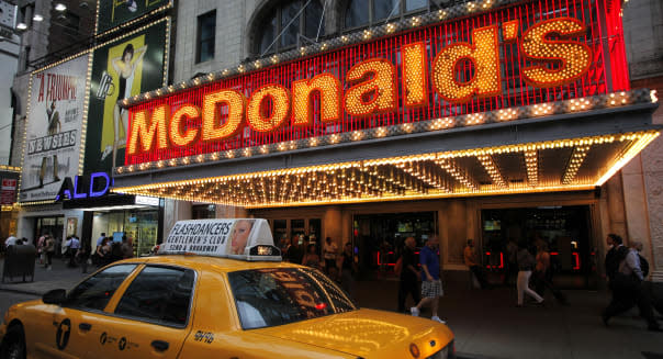 In this July 11, 2013 photo, a McDonald's marquis is illuminated in New York's Times Square. (AP Photo/Mark Lennihan)