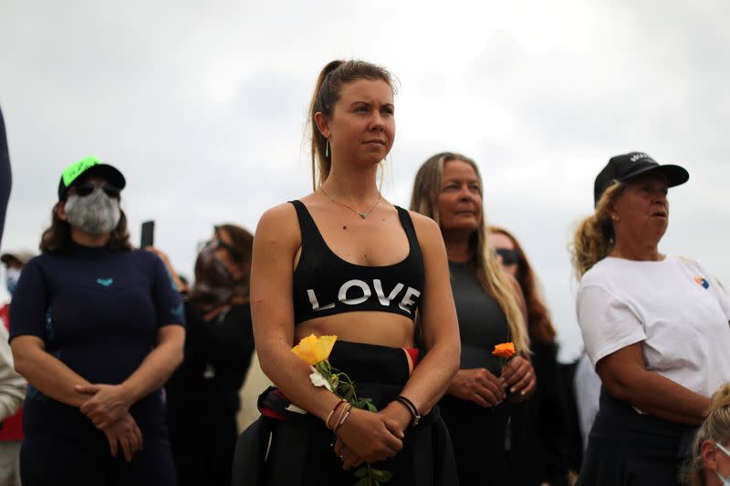 People prepare to surf at The Black Girls Surf paddle-out in memory of George Floyd, who died in Minneapolis police custody, in Santa Monica