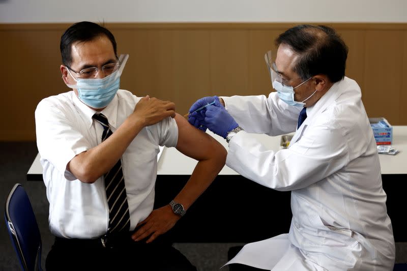 Director of the Tokyo Medical Center Kazuhiro Araki receives a dose of the coronavirus disease (COVID-19) vaccine as the country launches its inoculation campaign, in Tokyo, Japan