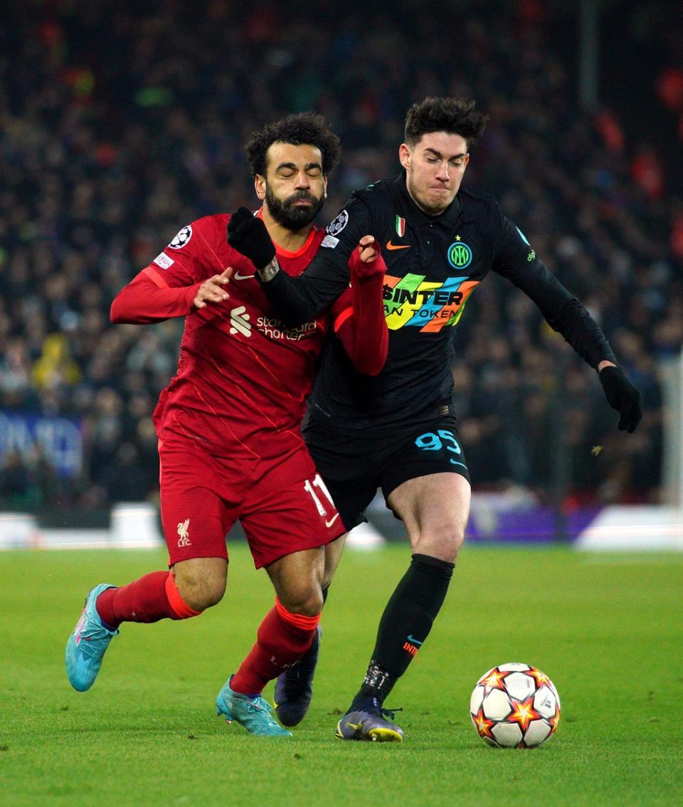 Liverpool’s Mohamed Salah, left, and Inter Milan’s Alessandro Bastoni battle for the ball (Peter Byrne/PA) (PA Wire)