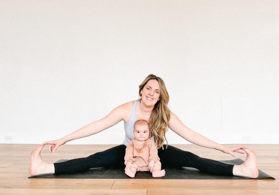 Yoga with baby - wide angle forward fold - Kate Lombardo