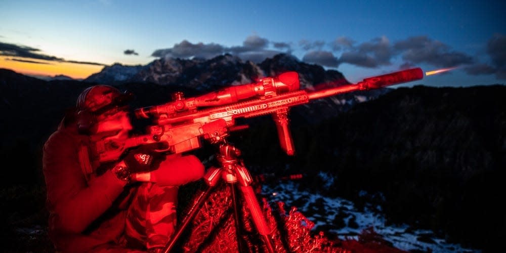 A Belgian Special Forces Sniper engages an elevated target at night during the High Angle Sniper Course, in Hochfilzen training area, Austria
