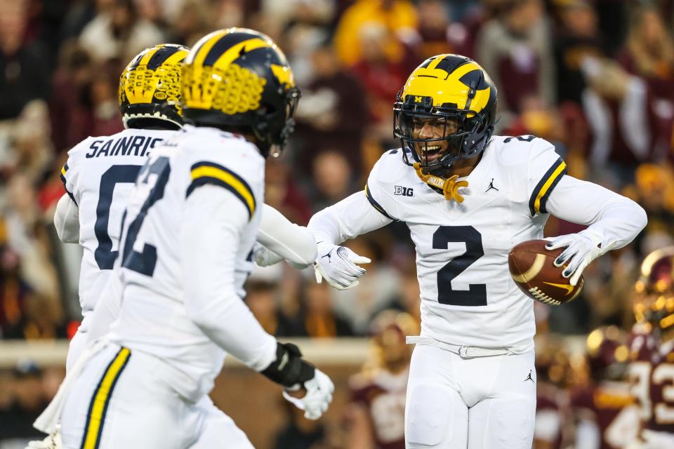 Michigan Wolverines defensive back Will Johnson (2) celebrates after returning an interception for a touchdown against the Minnesota Golden Gophers at Huntington Bank Stadium in Minneapolis on Saturday, Oct. 7, 2023.